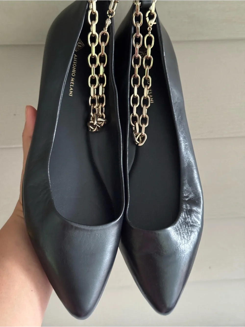 ANTONIO MELANI Black Leather Pointed-Toe Flats with Gold Chain Accent